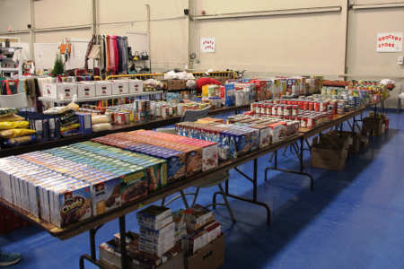 Tables filled with boxes of food to give away