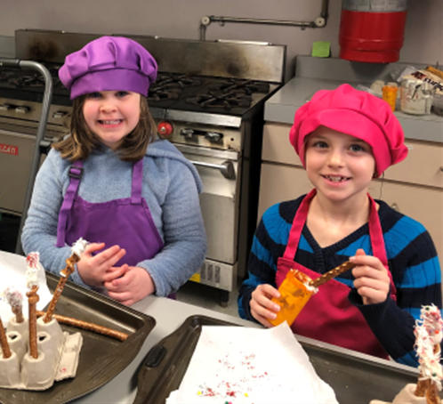 Two kids in the
		kitchen