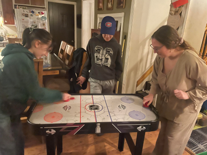 Playing air hockey