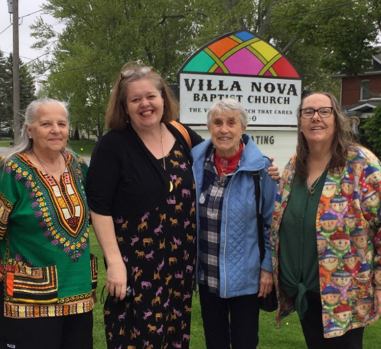 Gathering outside Villa Nova Baptist
		Church