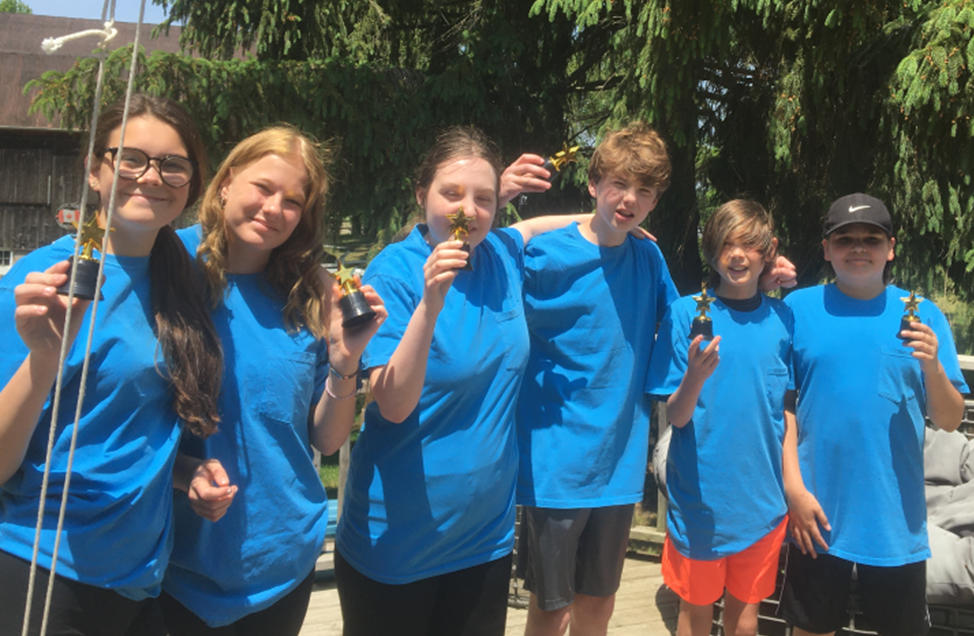 Holding up their trophies